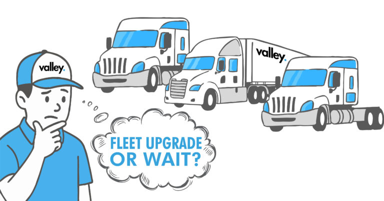 Line of modern trucks ready for dispatch at dawn Valley Trucking Insurance