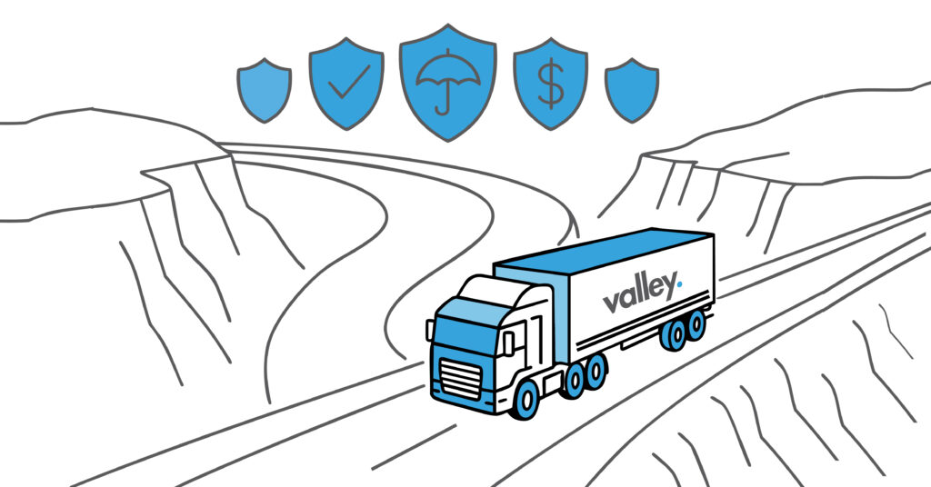 Truck fleet manager reviewing insurance documents and risk data